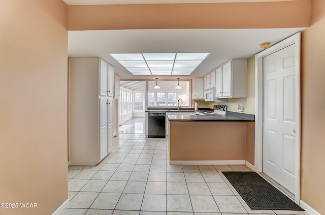 kitchen featuring white appliances, light tile patterned floors, white cabinets, dark countertops, and a peninsula