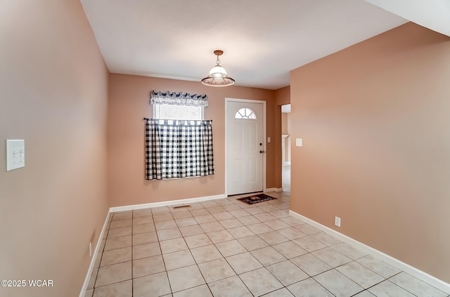 foyer entrance featuring visible vents and baseboards