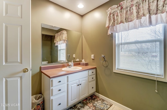 bathroom featuring vanity and baseboards