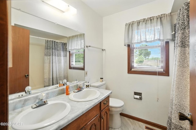 1619 Northbrook Dr, Lima, OH 45805 - full bathroom featuring plenty of natural light, double vanity, and curtained shower