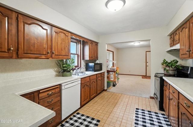 1619 Northbrook Dr, Lima, OH 45805 - kitchen with stainless steel range with electric cooktop, white dishwasher, black microwave, light countertops, and under cabinet range hood