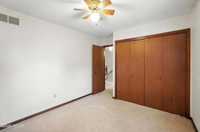 1619 Northbrook Dr, Lima, OH 45805 - unfurnished bedroom featuring light carpet, a closet, and a ceiling fan