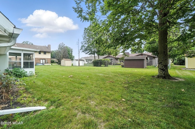 1619 Northbrook Dr, Lima, OH 45805 - view of yard with a storage shed and a sunroom