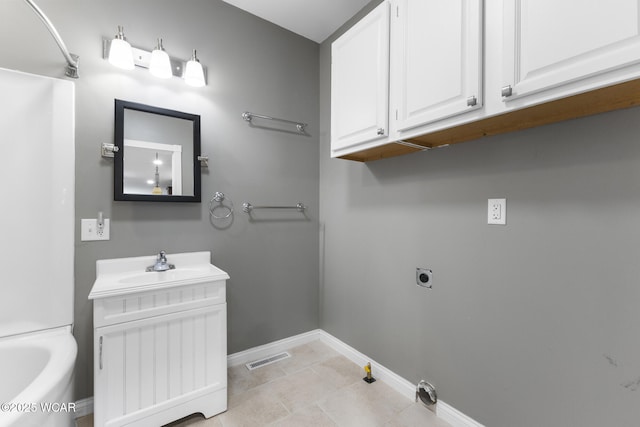 3139 Clifford Dr, Lima, OH 45805 - bathroom featuring vanity, a bathtub, and tile patterned floors