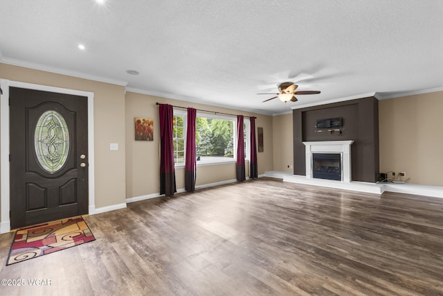 3139 Clifford Dr, Lima, OH 45805 - unfurnished living room featuring ceiling fan, wood finished floors, ornamental molding, a fireplace with raised hearth, and a textured ceiling