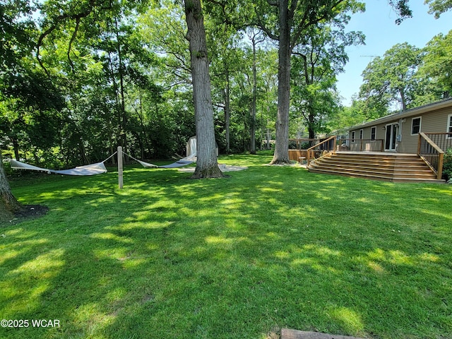 3139 Clifford Dr, Lima, OH 45805 - view of grassy yard with stairs and a wooden deck