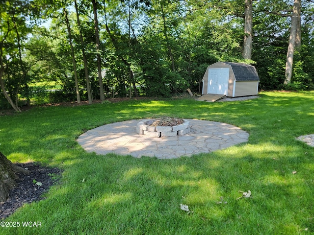 3139 Clifford Dr, Lima, OH 45805 - view of green lawn featuring a storage shed and a fire pit