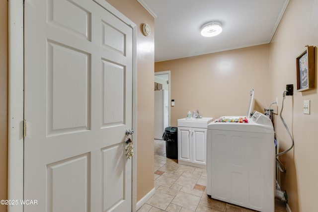 5295 E Rd, Lima, OH 45807 - clothes washing area with a sink, washer / dryer, and cabinet space
