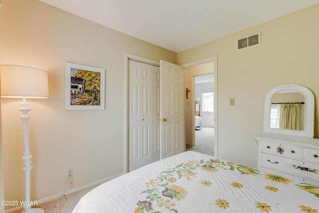 5295 E Rd, Lima, OH 45807 - carpeted bedroom with visible vents, baseboards, and a closet