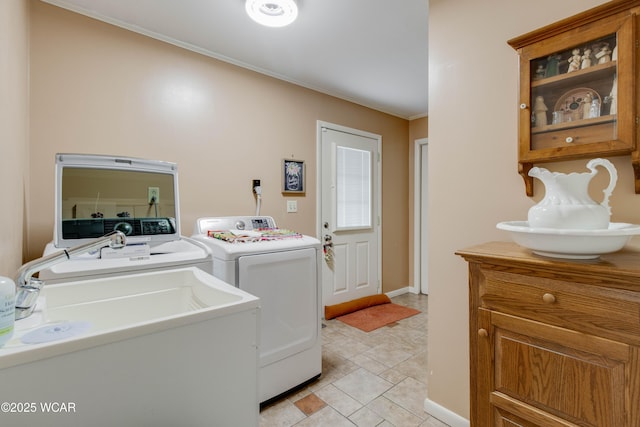 5295 E Rd, Lima, OH 45807 - washroom with laundry area, a sink, baseboards, separate washer and dryer, and ornamental molding