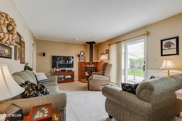 5295 E Rd, Lima, OH 45807 - carpeted living area with ornamental molding, a wood stove, and visible vents
