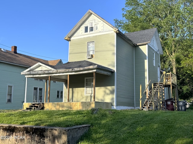 307 Harrison Ave, Lima, OH 45804 - rear view of house featuring stairway, a lawn, and roof with shingles