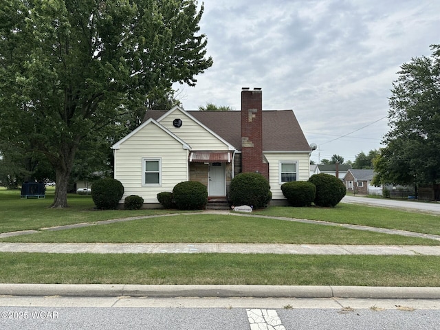 400 N Westminster St, Waynesfield, OH 45896 - view of front of property featuring a front yard and a chimney