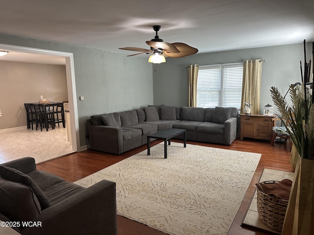 400 N Westminster St, Waynesfield, OH 45896 - living area with a ceiling fan and dark wood-style floors