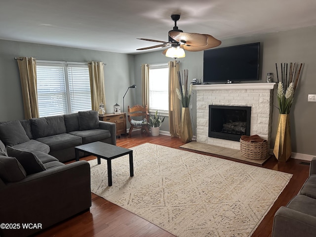 400 N Westminster St, Waynesfield, OH 45896 - living room with ceiling fan, a fireplace, and wood finished floors