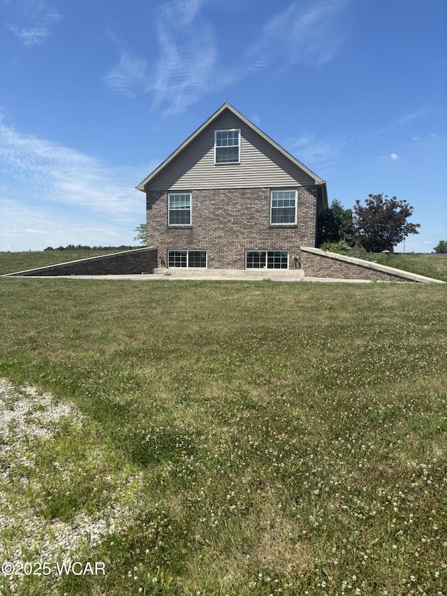 25853 Rd M, Cloverdale, OH 45827 - view of side of property with a yard and brick siding