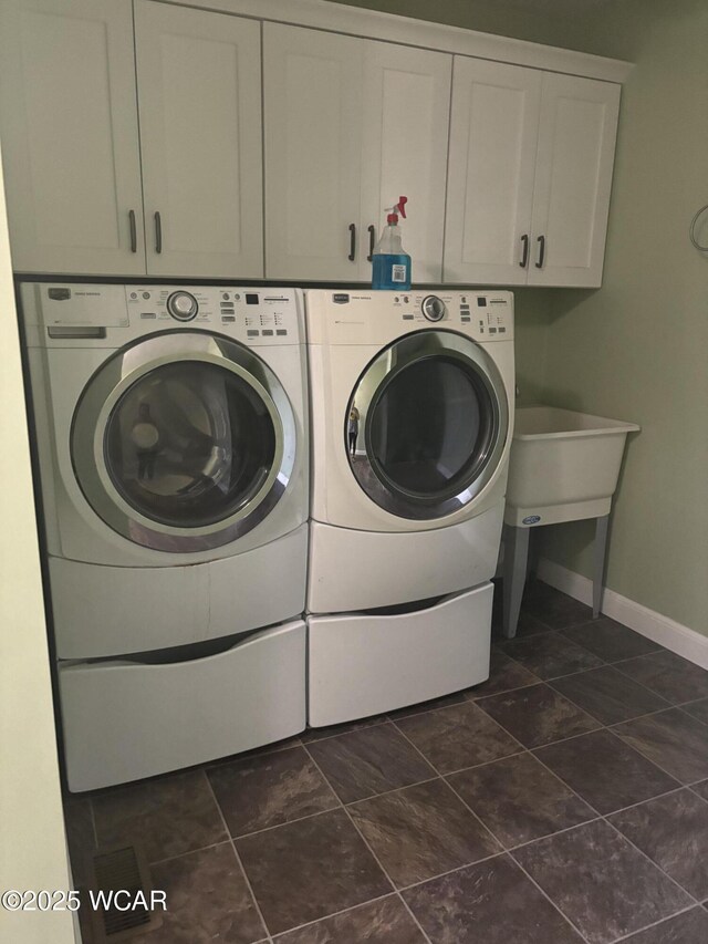 25853 Rd M, Cloverdale, OH 45827 - washroom featuring washing machine and dryer and cabinet space