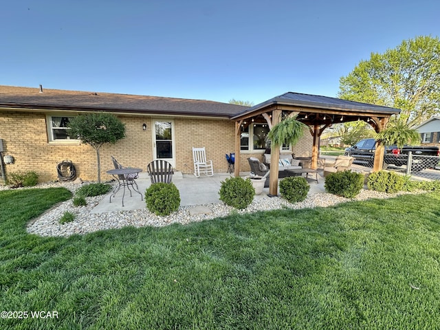 305 Fenway Dr, Lima, OH 45804 - back of house featuring a patio, brick siding, outdoor lounge area, and a gazebo