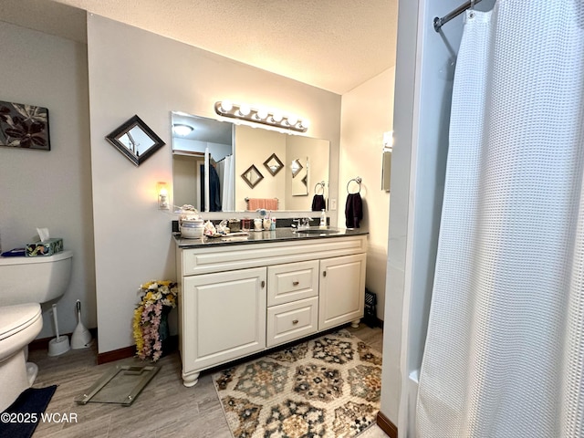 305 Fenway Dr, Lima, OH 45804 - full bathroom with vanity, wood finished floors, and a shower with shower curtain