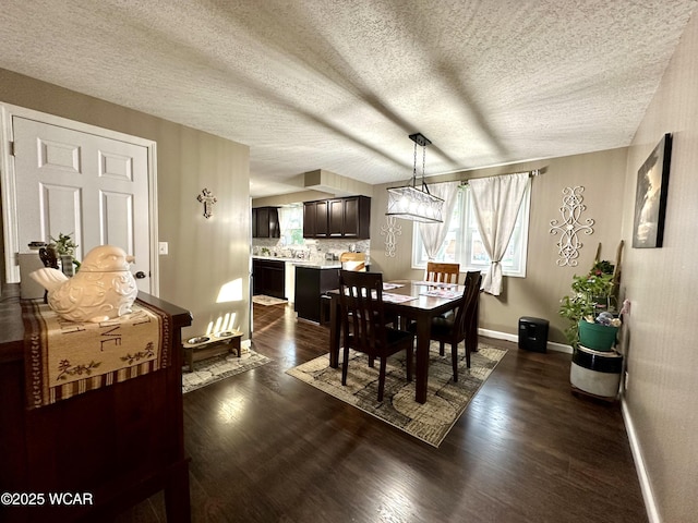 305 Fenway Dr, Lima, OH 45804 - dining room with dark wood-style flooring and a textured ceiling