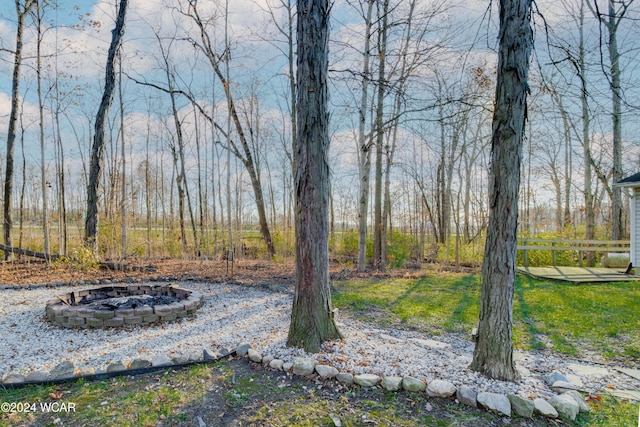 view of yard with a fire pit