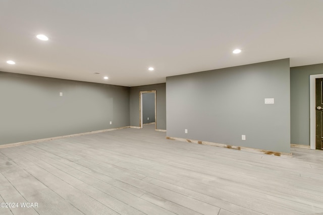 basement featuring light wood-type flooring