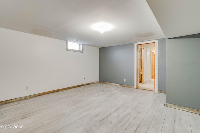 basement featuring light wood-type flooring