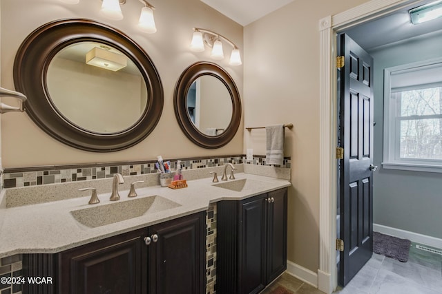 bathroom with vanity, tile patterned floors, and decorative backsplash