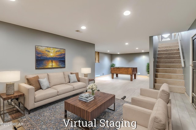 living room with hardwood / wood-style flooring and billiards