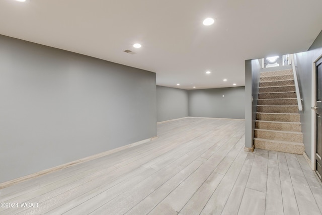 basement featuring light hardwood / wood-style floors