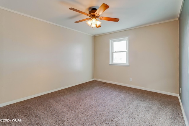 carpeted spare room with ornamental molding and ceiling fan