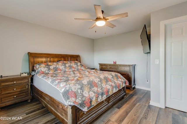 bedroom featuring dark hardwood / wood-style floors and ceiling fan