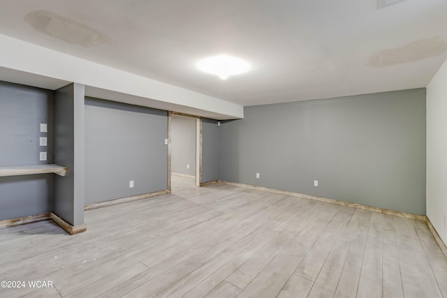 basement featuring light wood-type flooring