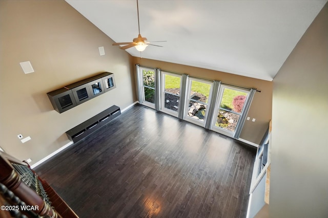 4441 Indian Hill Dr, Lima, OH 45806 - unfurnished living room with high vaulted ceiling, a ceiling fan, dark wood-style floors, and baseboards