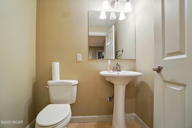 4441 Indian Hill Dr, Lima, OH 45806 - half bath featuring toilet, baseboards, and tile patterned flooring