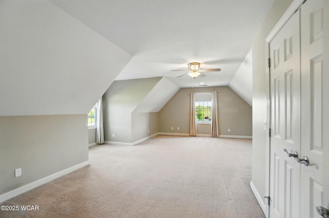 4441 Indian Hill Dr, Lima, OH 45806 - additional living space featuring ceiling fan, light carpet, lofted ceiling, and baseboards