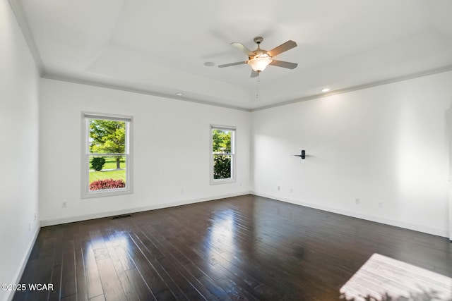 4441 Indian Hill Dr, Lima, OH 45806 - unfurnished room with a tray ceiling, healthy amount of natural light, ceiling fan, dark wood-style floors, and recessed lighting