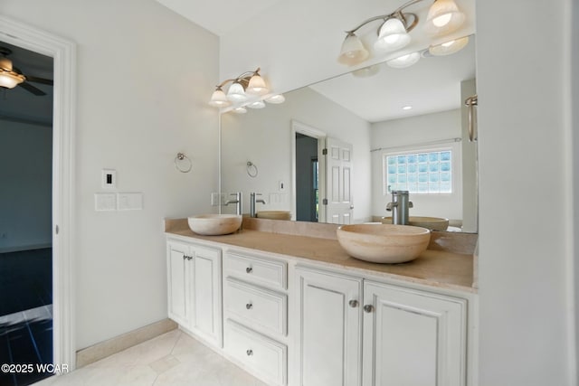 4441 Indian Hill Dr, Lima, OH 45806 - bathroom with double vanity, tile patterned flooring, baseboards, and a ceiling fan