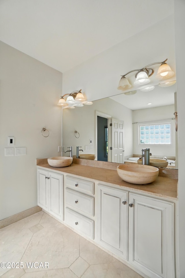 4441 Indian Hill Dr, Lima, OH 45806 - full bathroom with double vanity, baseboards, and tile patterned floors