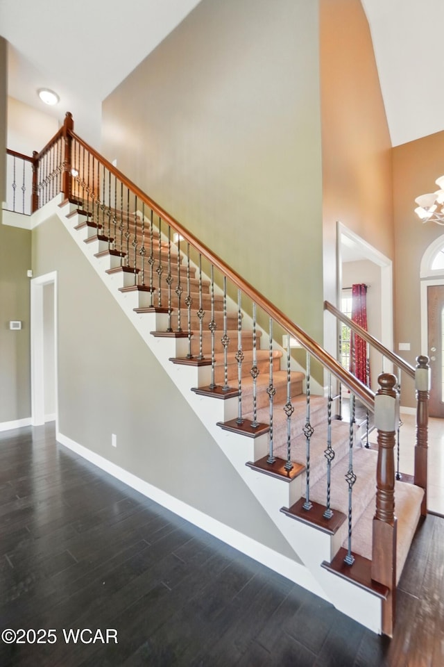 4441 Indian Hill Dr, Lima, OH 45806 - stairs featuring a towering ceiling, wood finished floors, and baseboards