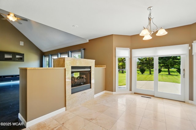 4441 Indian Hill Dr, Lima, OH 45806 - foyer entrance with a chandelier, a tiled fireplace, baseboards, and ceiling fan