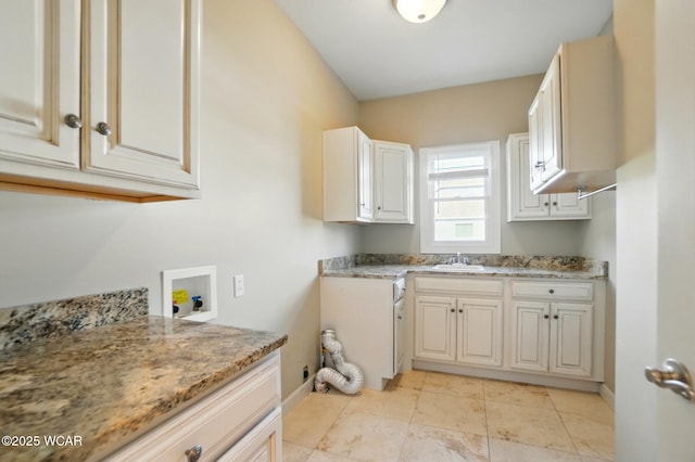 4441 Indian Hill Dr, Lima, OH 45806 - laundry area featuring cabinet space, washer hookup, baseboards, and light tile patterned floors