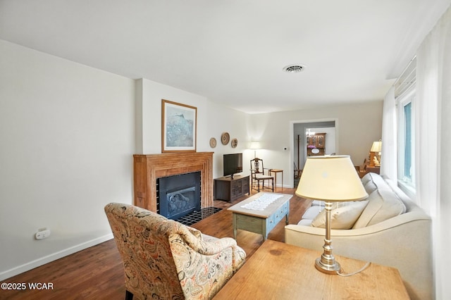 2619 Wendell Ave, Lima, OH 45805 - living area featuring wood finished floors and a fireplace with flush hearth