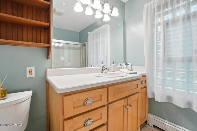 2619 Wendell Ave, Lima, OH 45805 - bathroom with baseboard heating, vanity, and tile patterned floors