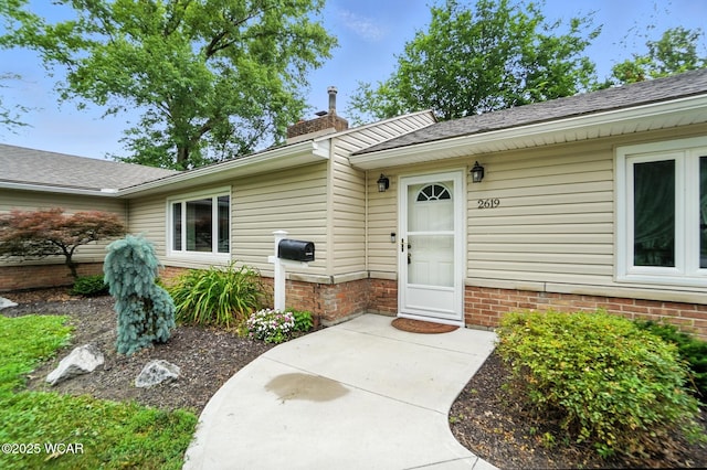 2619 Wendell Ave, Lima, OH 45805 - property entrance with a chimney and a shingled roof