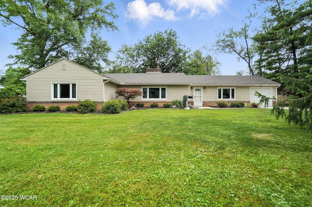 2619 Wendell Ave, Lima, OH 45805 - single story home featuring brick siding, a front yard, a chimney, and an attached garage