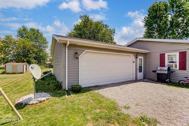 garage featuring a yard