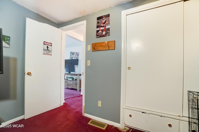 hallway featuring carpet floors