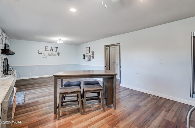 1280 Wonderlick Rd, Lima, OH 45805 - dining area featuring wood finished floors, ceiling fan, and baseboards