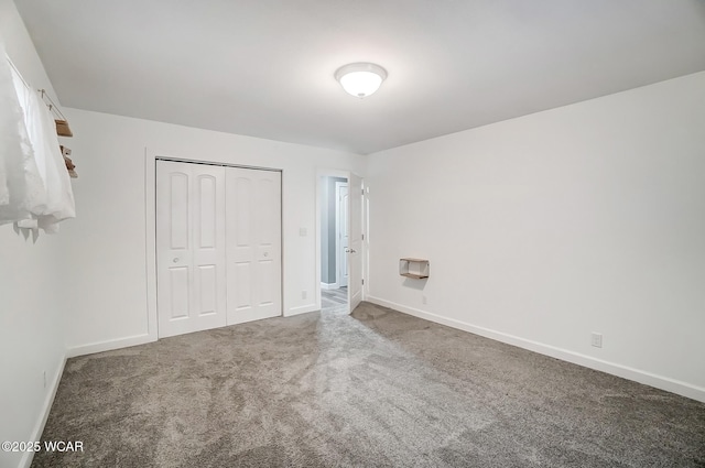 1280 Wonderlick Rd, Lima, OH 45805 - unfurnished bedroom with carpet flooring, baseboards, and a closet